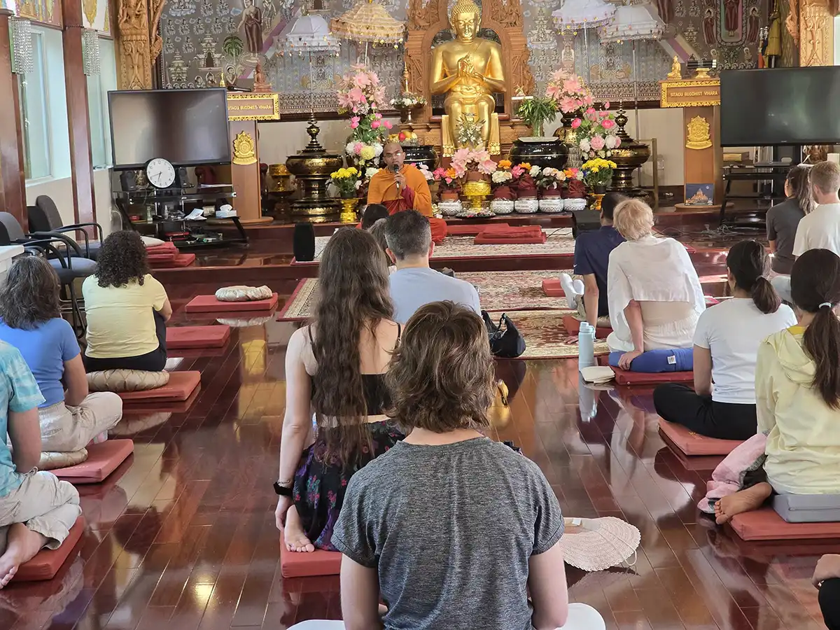 Meditation practitioners in hall